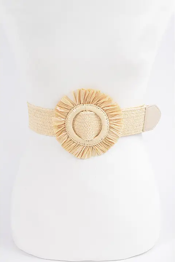 Beige woven belt with decorative element on a white background