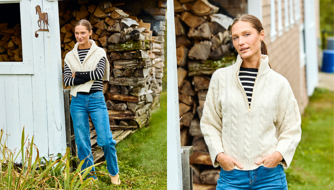 Woman wearing a stripe sweater and jeans in front of a stack of fire wood