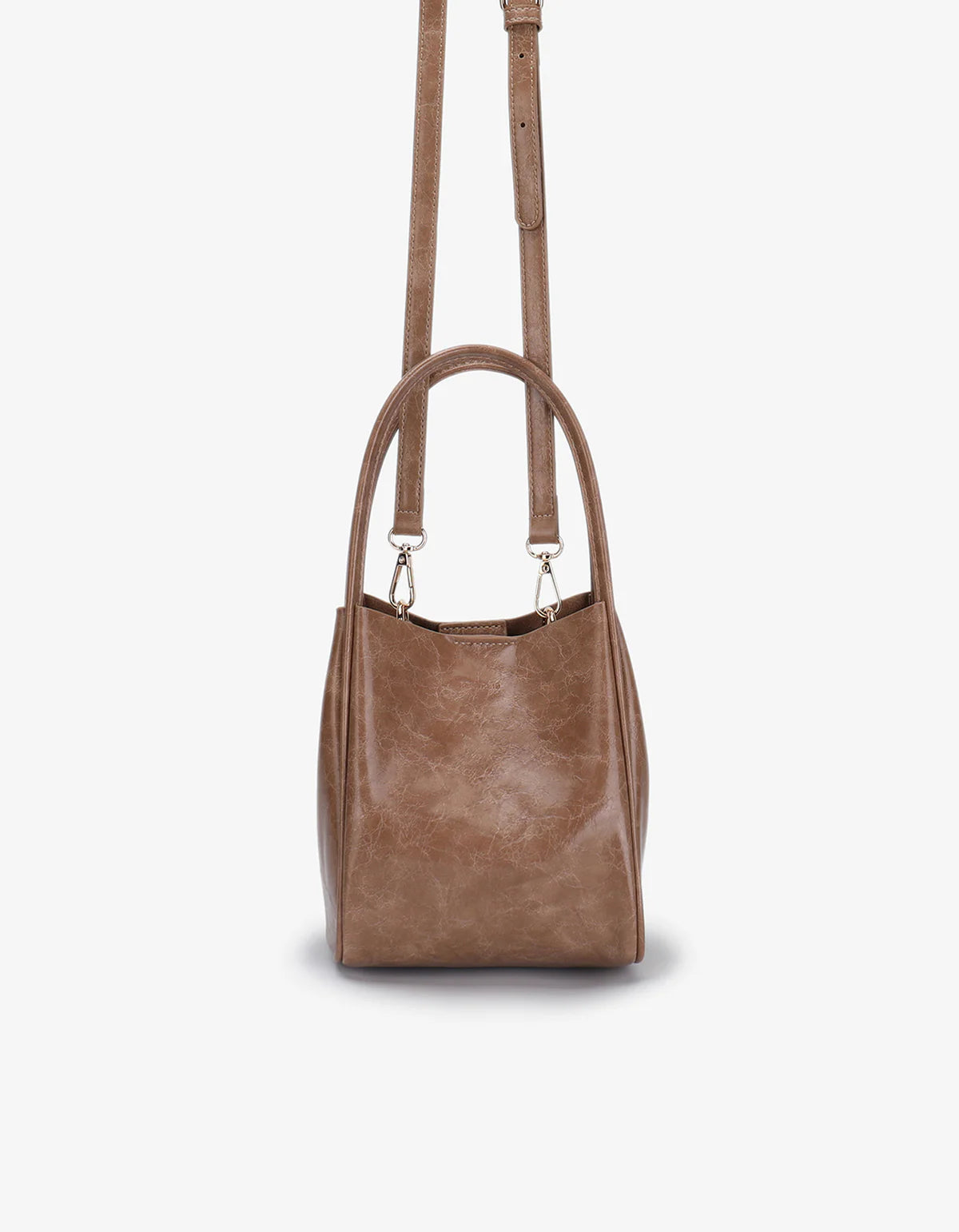 Brown leather handbag with a shoulder strap on a white background