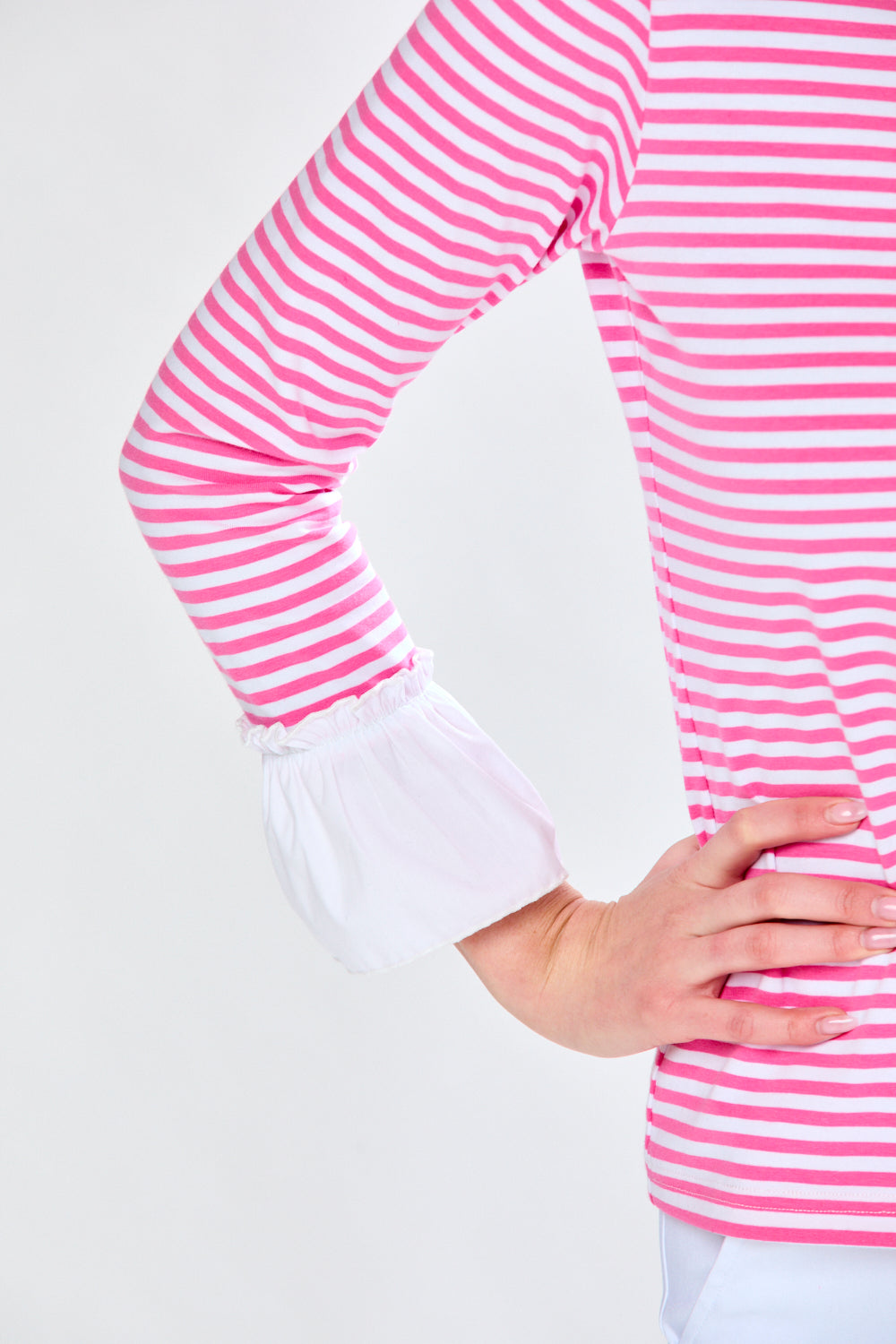 Woman in pink and white stripe top