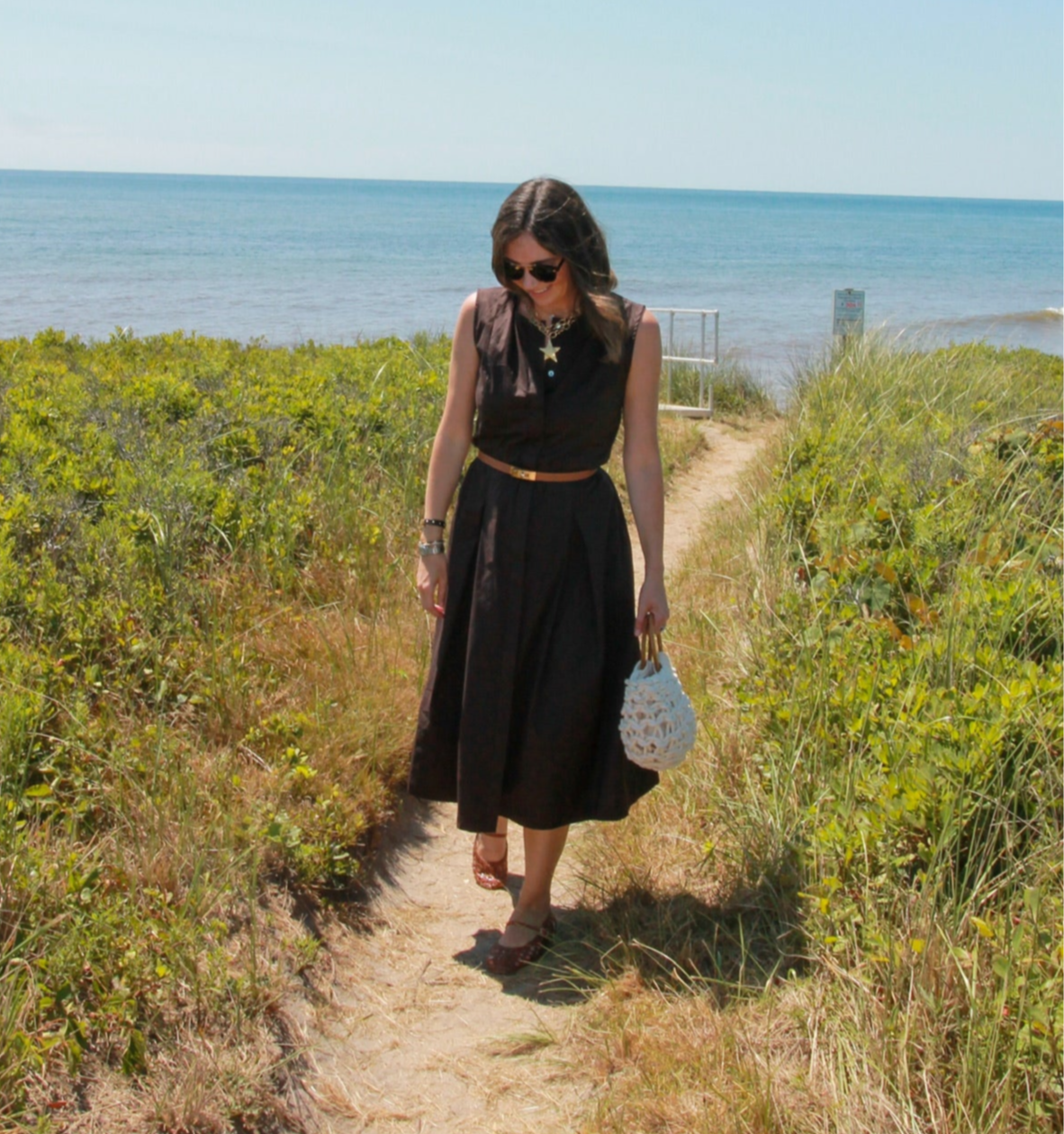 Woman wearing a brown maxi dress