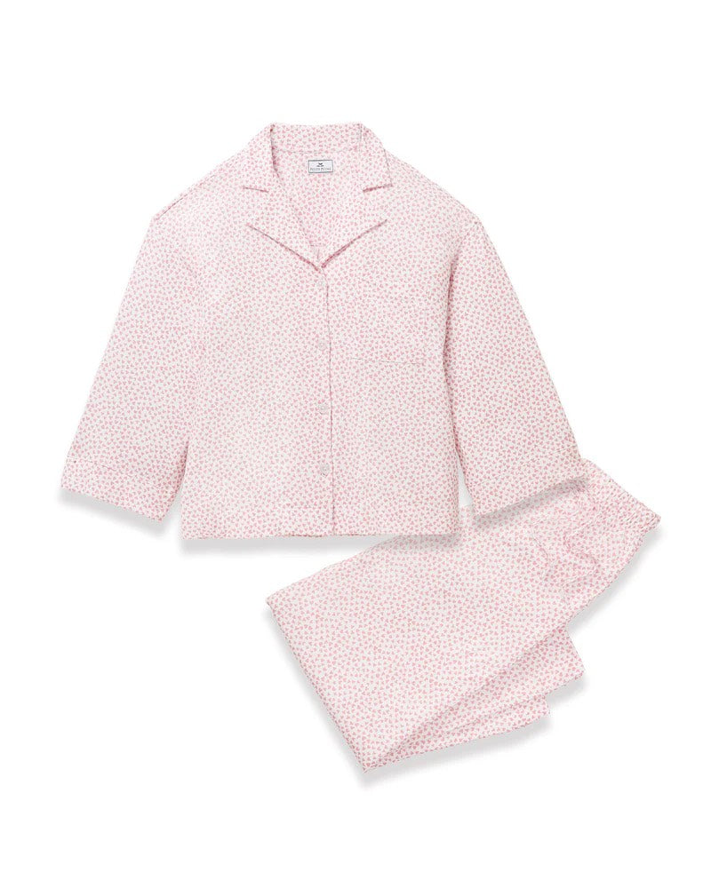 Pink pajama set with a subtle pattern on a white background