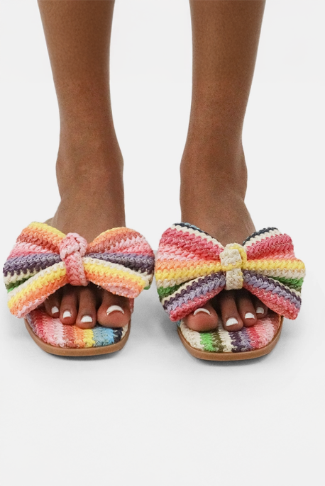 Woman wearing rainbow sandals