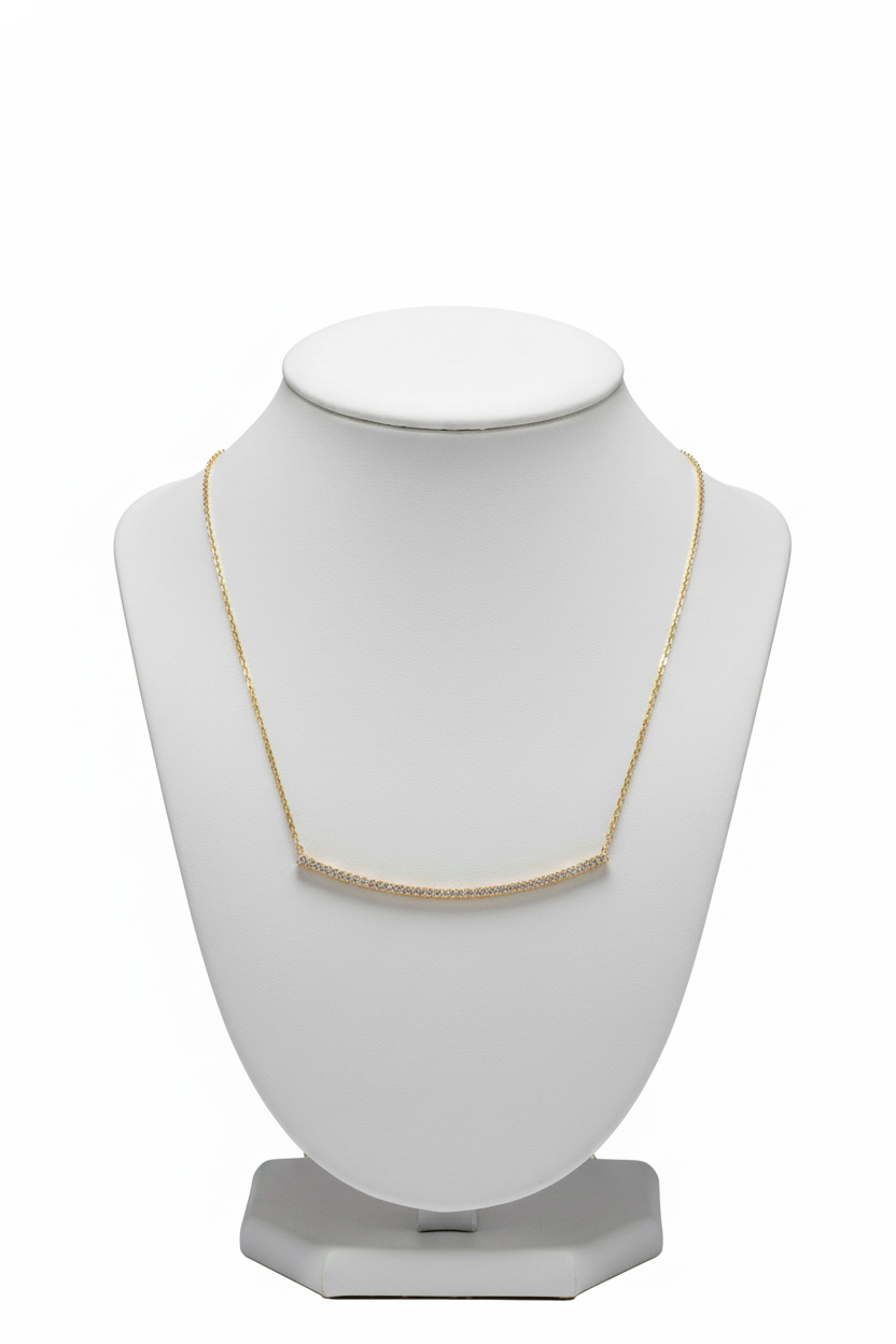 Gold necklace on a jewelry stand