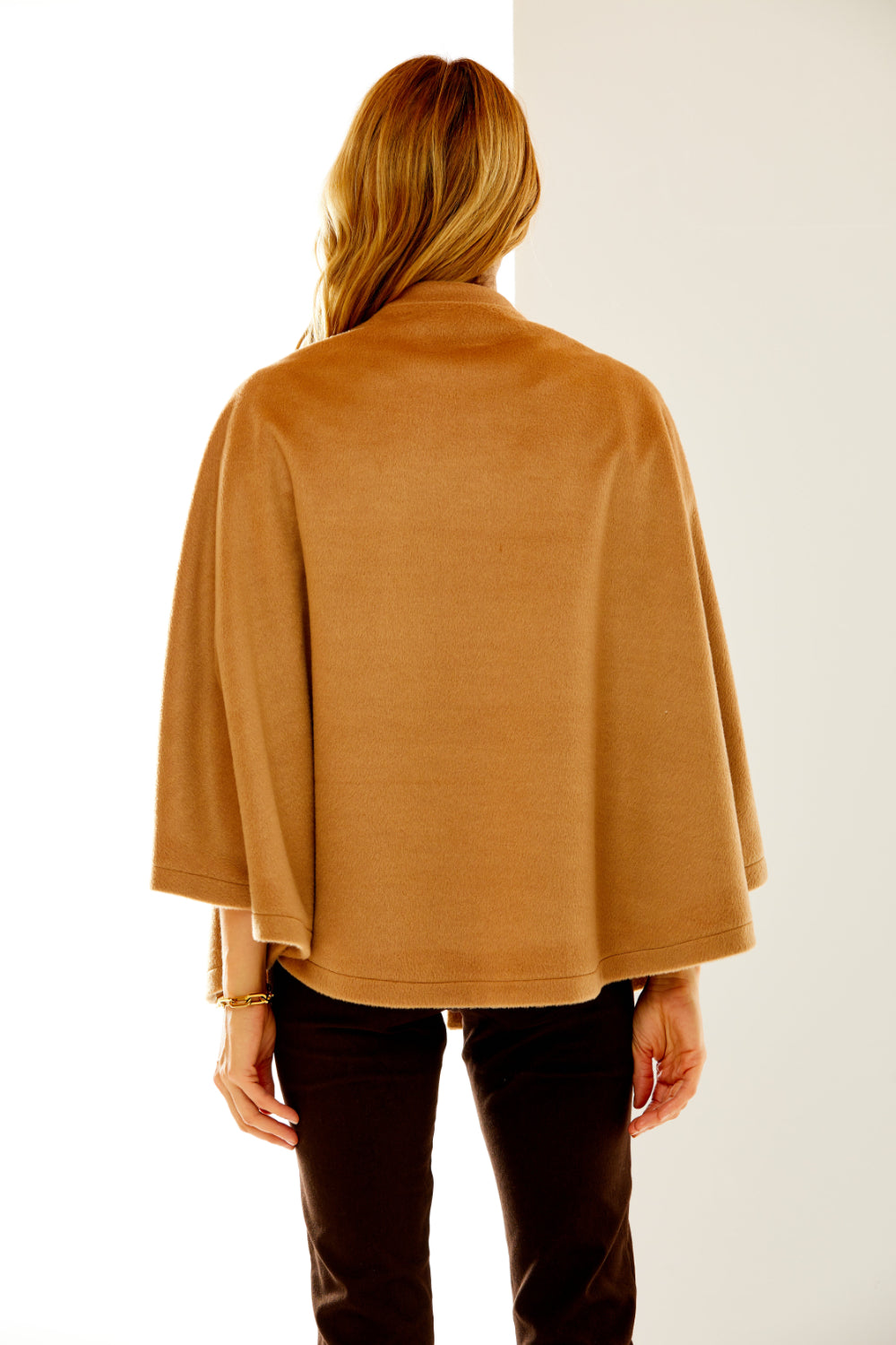 Woman in camel wool cape