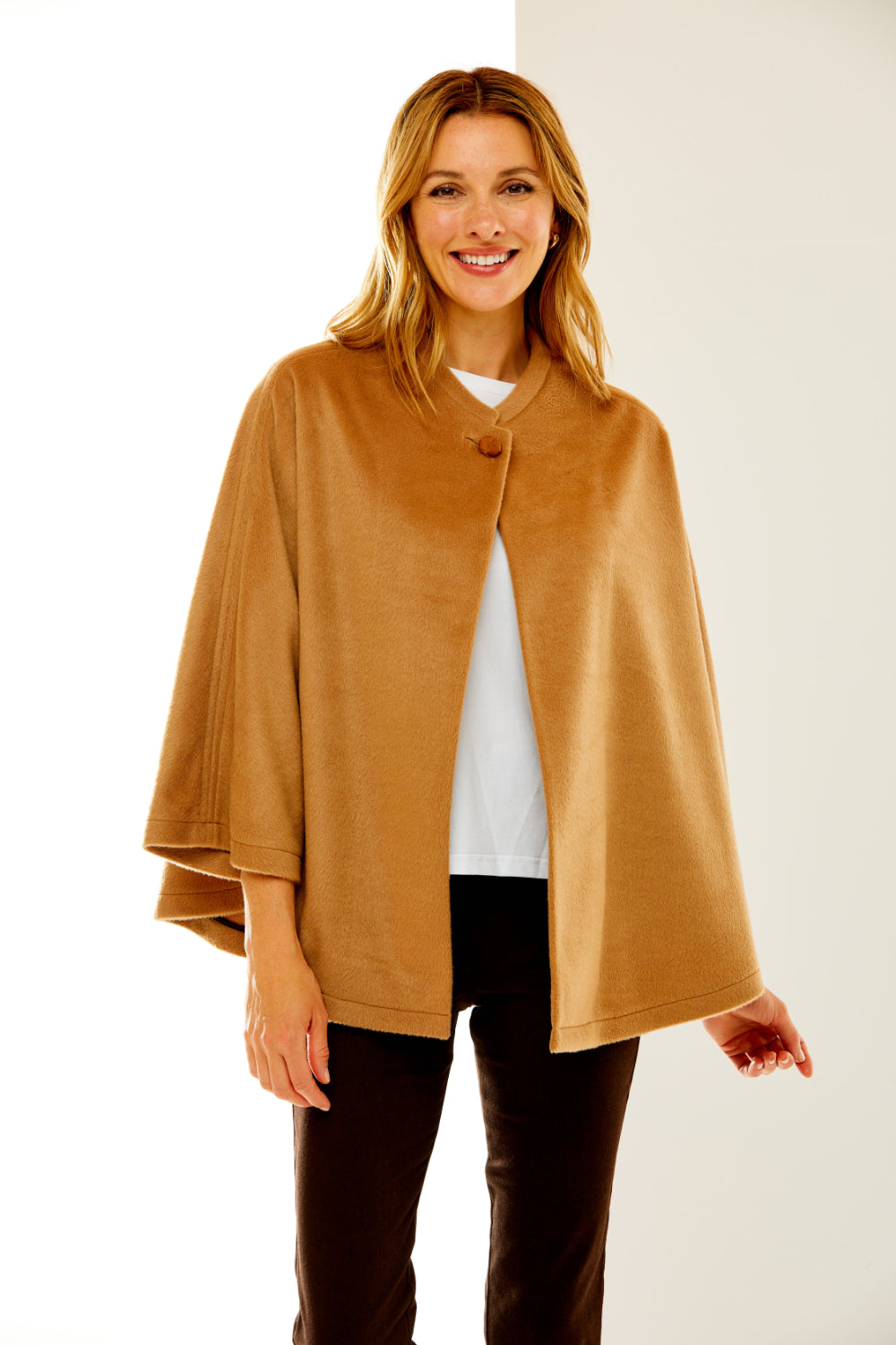 Woman in camel wool cape