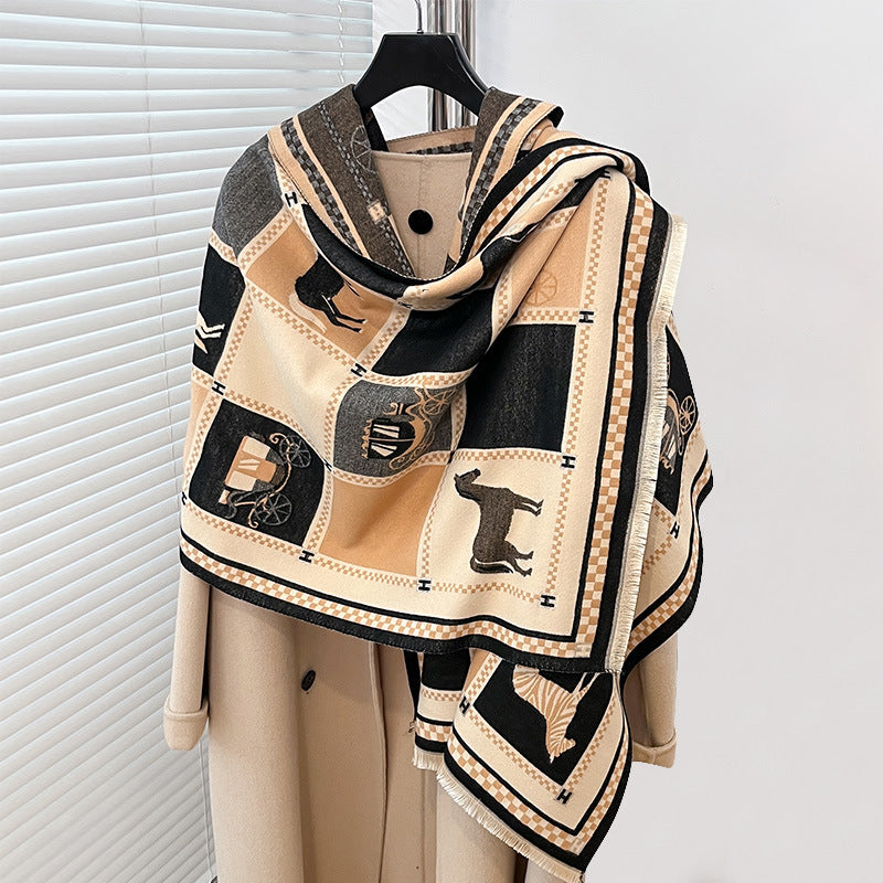 Patterned scarf with black and beige design on a hanger against a white background