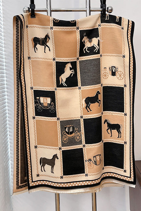 scarf with horse and carriage patterns hanging on a rack.