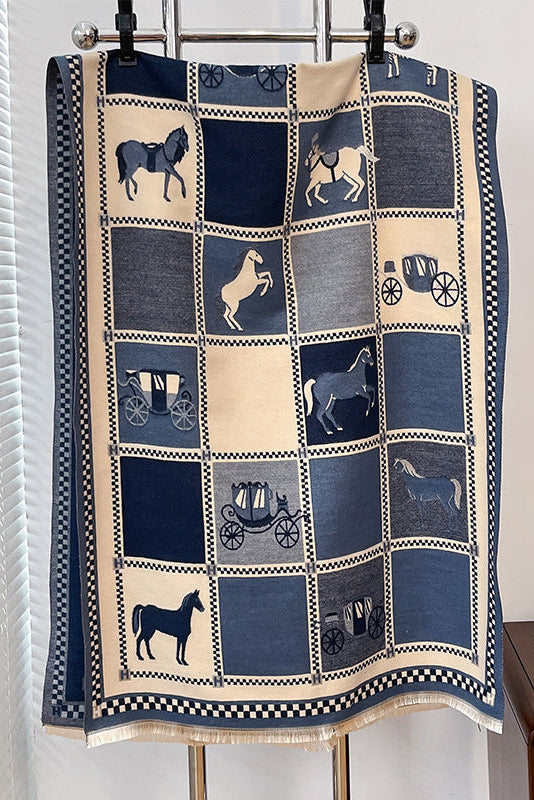 scarf with horse and carriage pattern hanging on a rack.