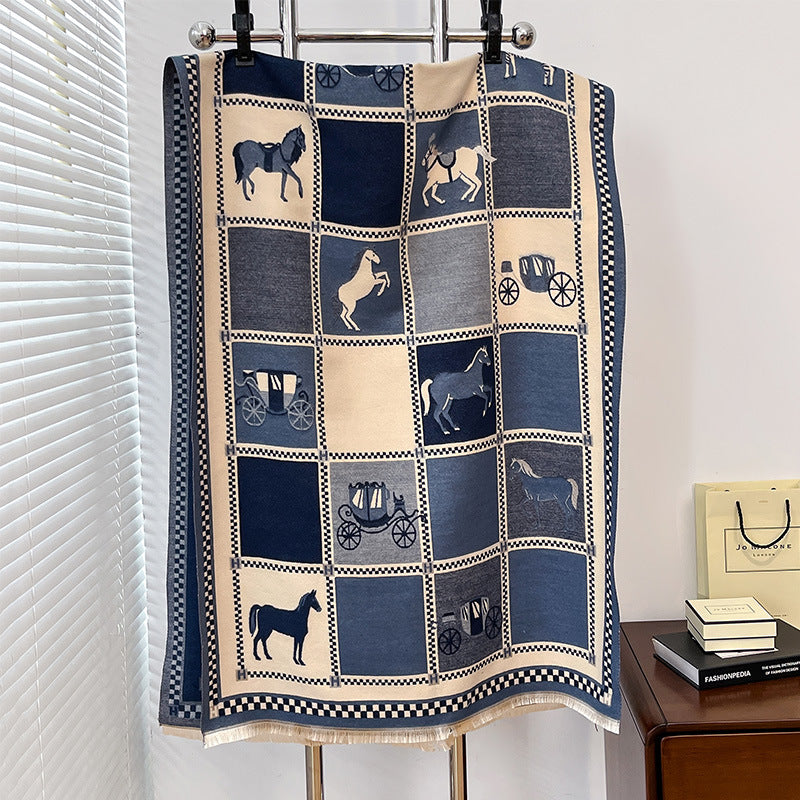 Quilt with horse and carriage pattern hanging on a rack.