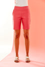 woman in fitted Bermuda shorts