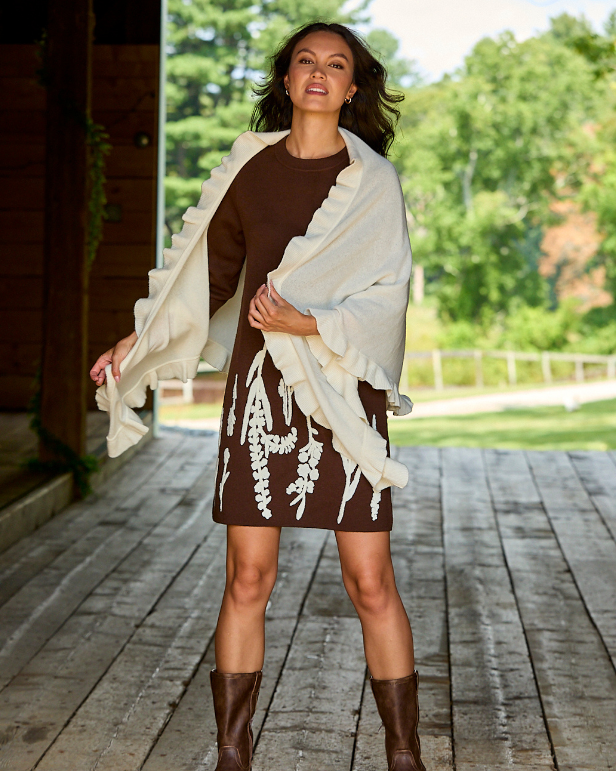 Girl wearing the cashmere ruffle triangle in ivory