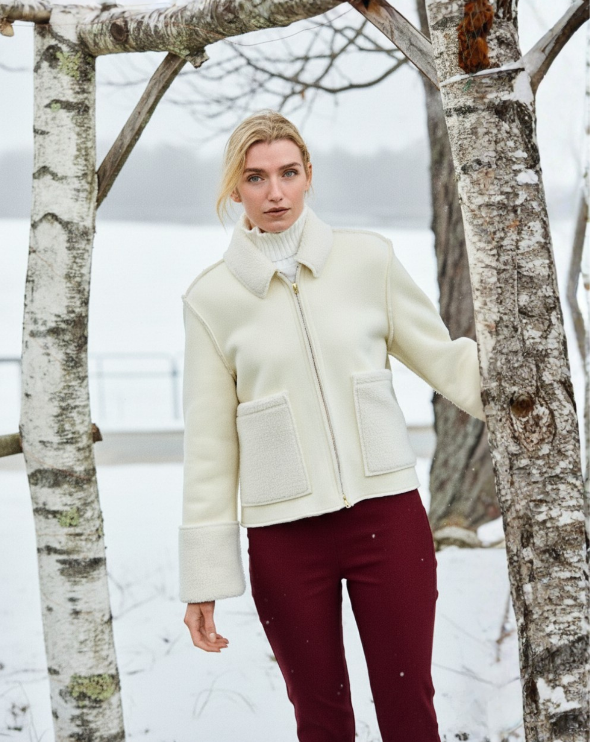 Girl in white jacket in the snow