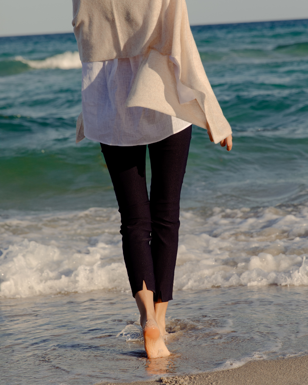 girl wearing sheri pants on the beach