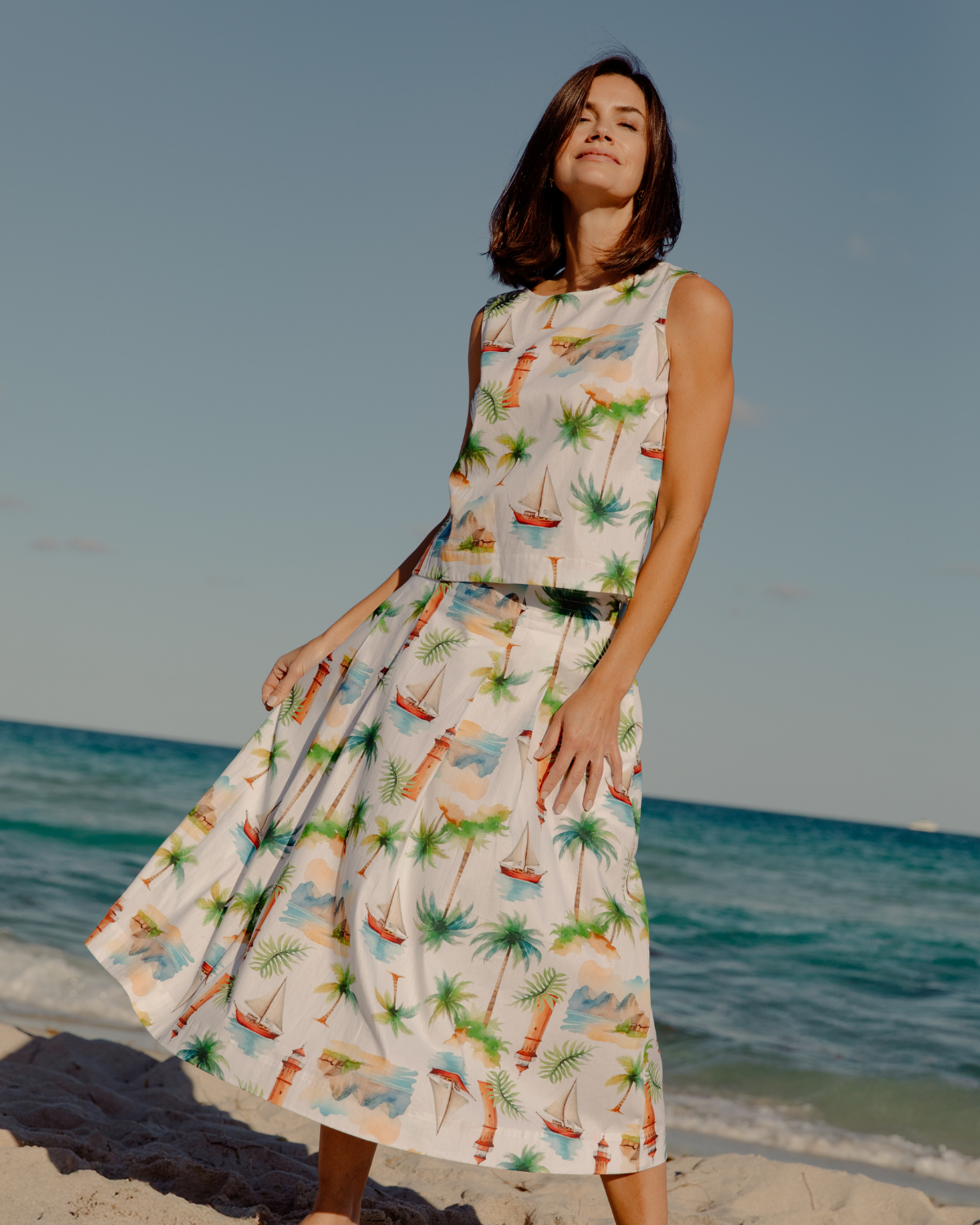 a woman wearing  Weston Top in Tropical Island and  Ruby Skirt in Tropical Island