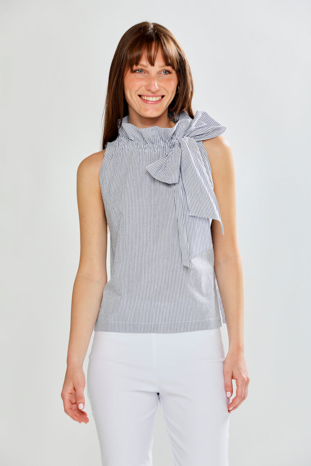 Woman wearing SLEEVELESS TOP W/TIE AT NECK