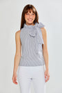 Woman wearing SLEEVELESS TOP W/TIE AT NECK