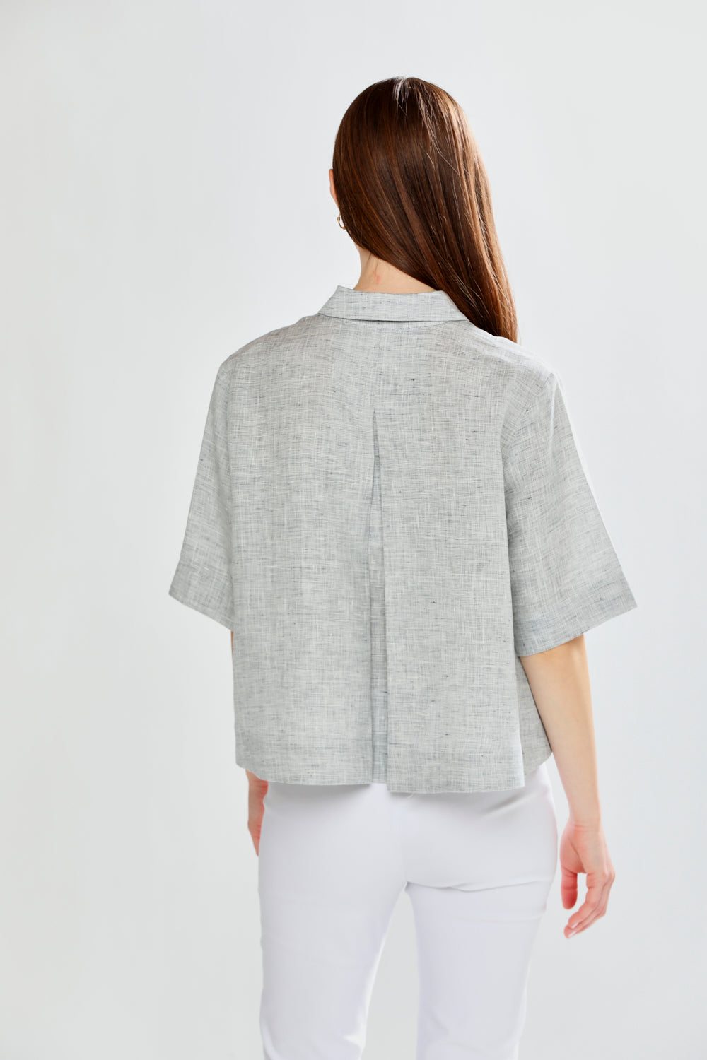 Woman in a linen button down top