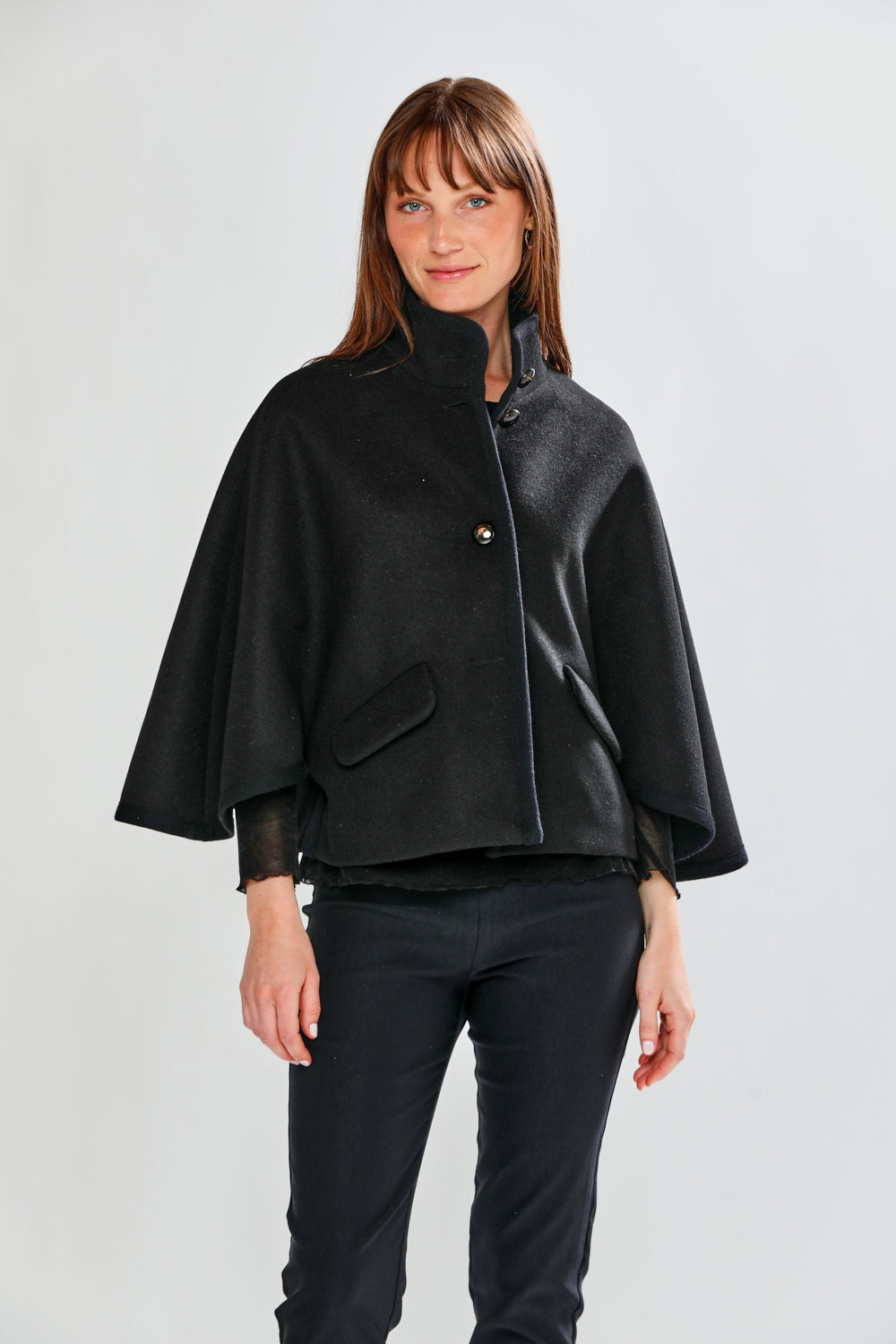 Woman wearing CLAUDIE CAPE - BLACK