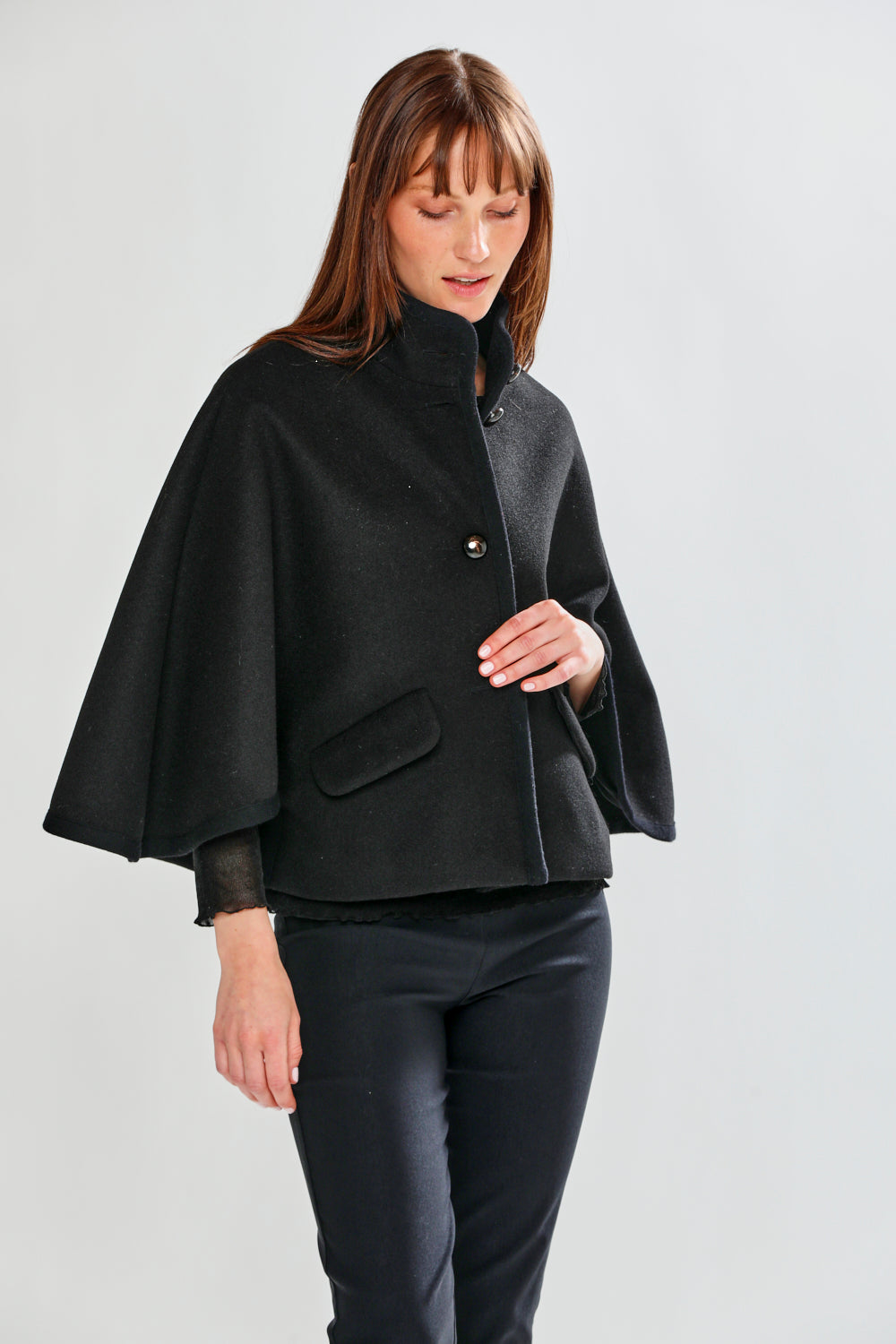Woman wearing CLAUDIE CAPE - BLACK
