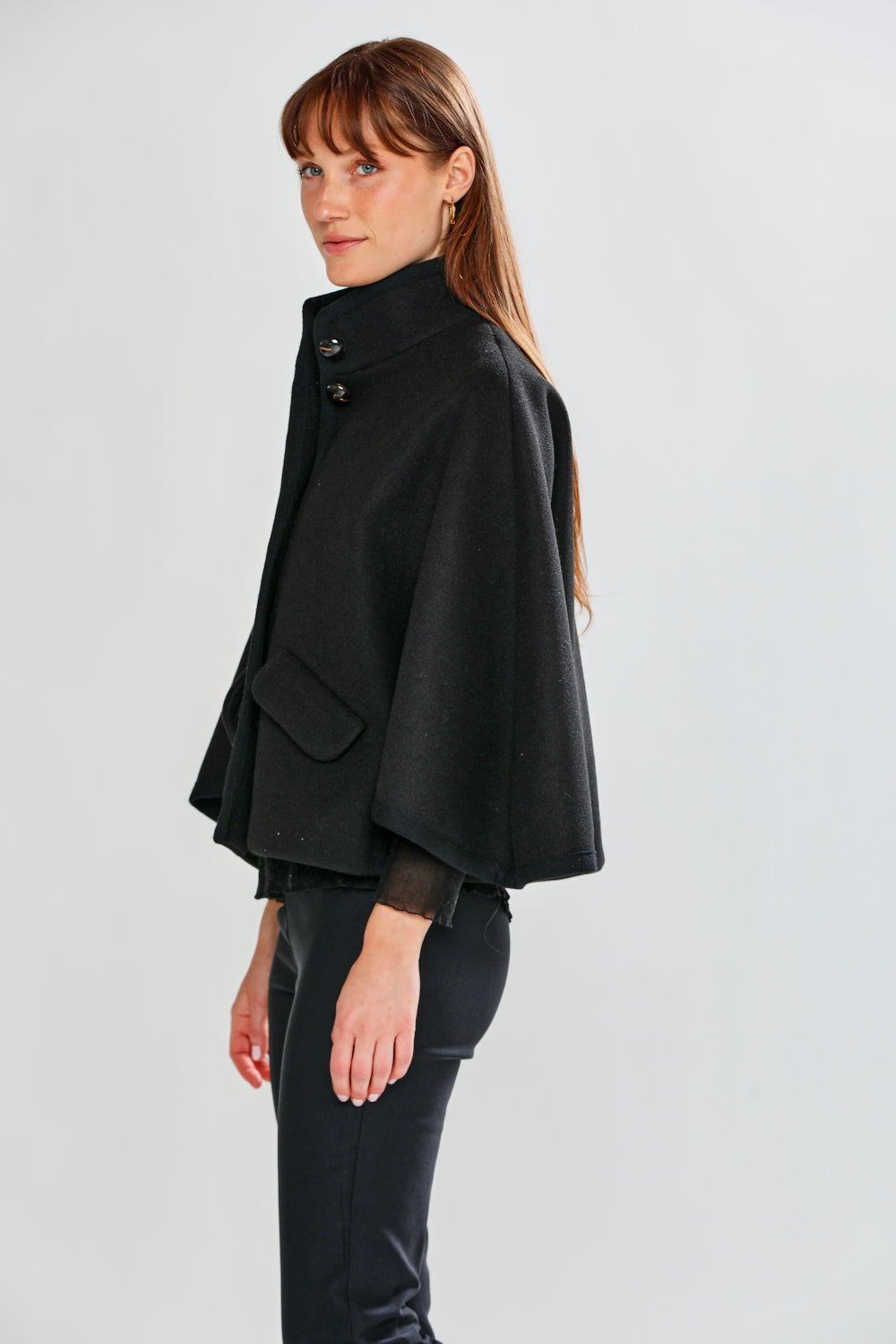 Woman wearing CLAUDIE CAPE - BLACK
