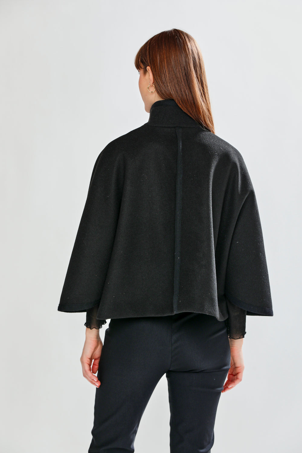 Woman wearing CLAUDIE CAPE - BLACK