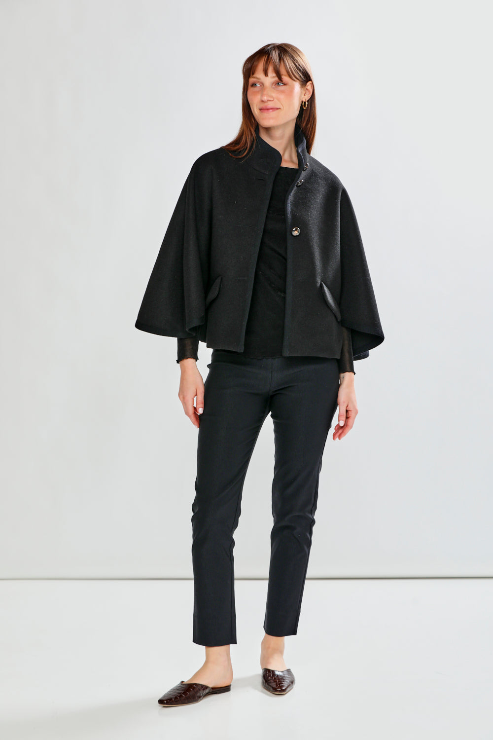 Woman wearing CLAUDIE CAPE - BLACK