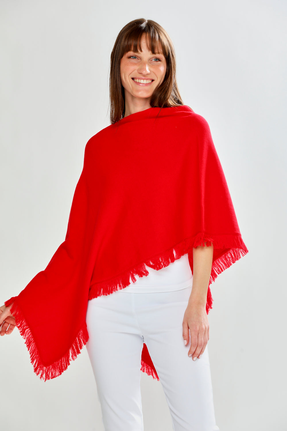 Woman wearing FRINGE RUANA - RED APPLE