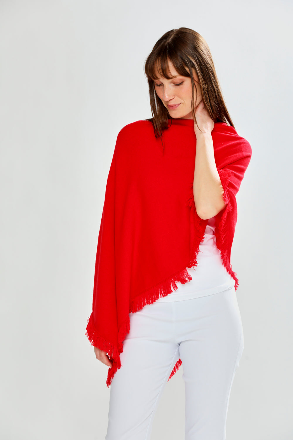 Woman wearing FRINGE RUANA - RED APPLE