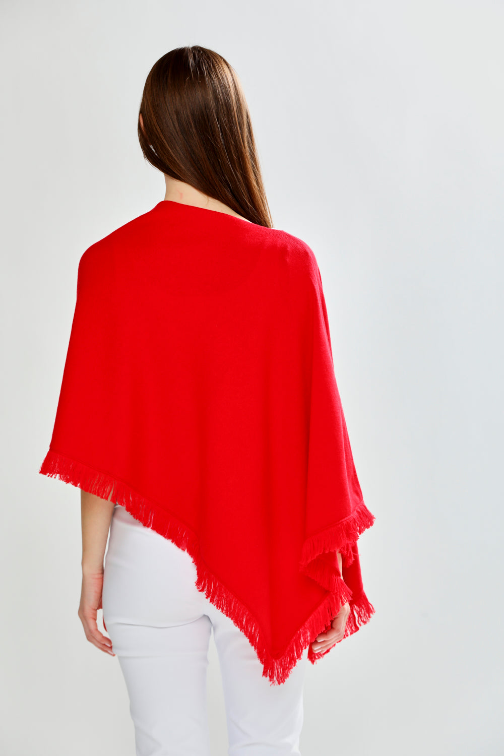 Woman wearing FRINGE RUANA - RED APPLE