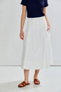 woman in pleated skirt