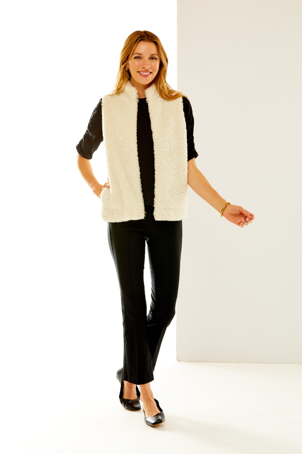 Woman in shearling vest