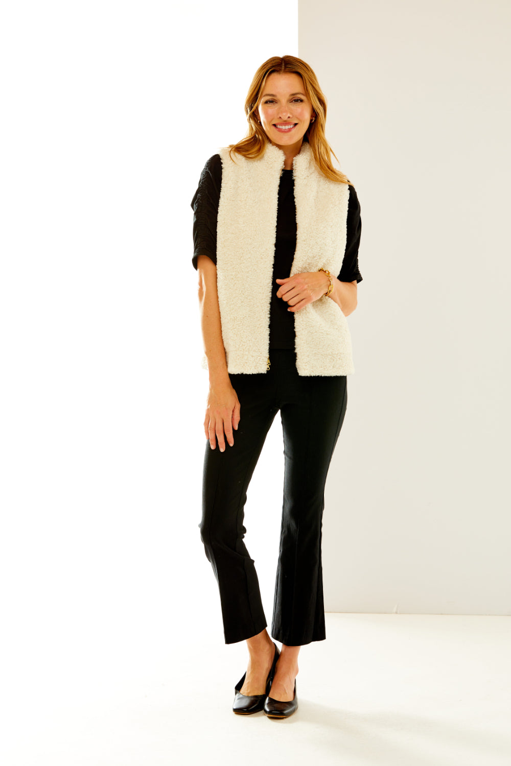 Woman in shearling vest