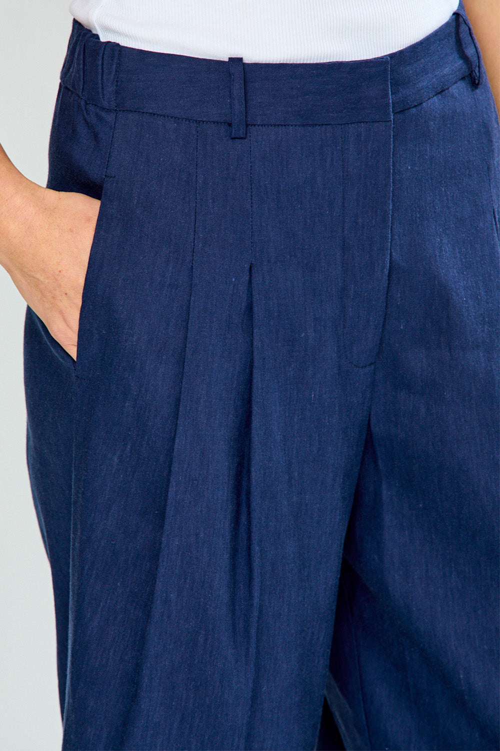 Close-up of blue pants with a white background