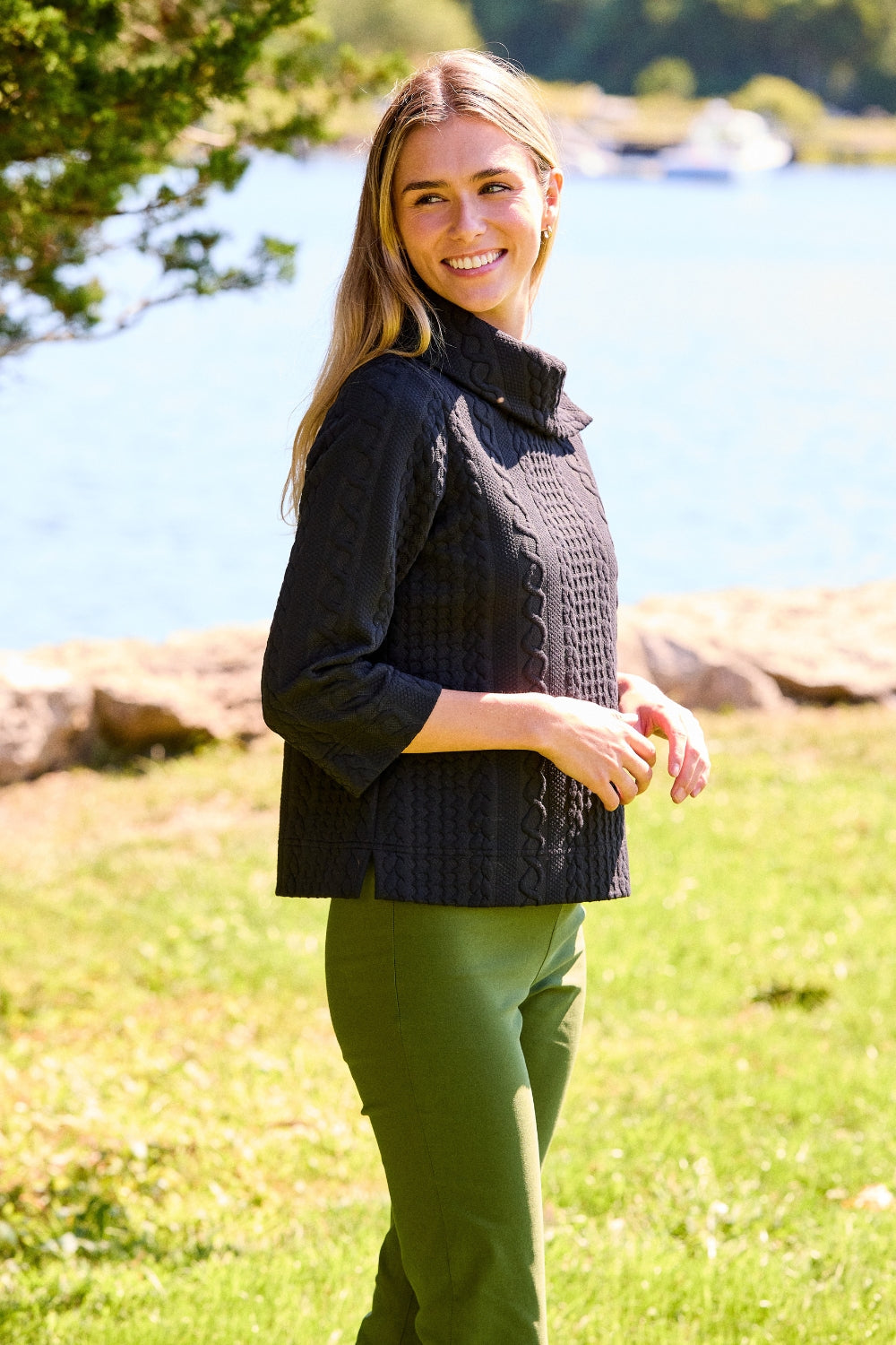 girl in black sweater and green pants 