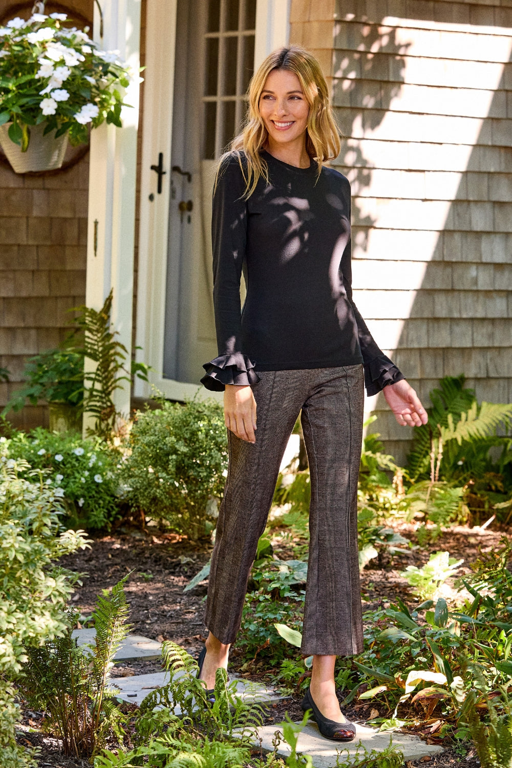 girl in flare pants and black shirt 