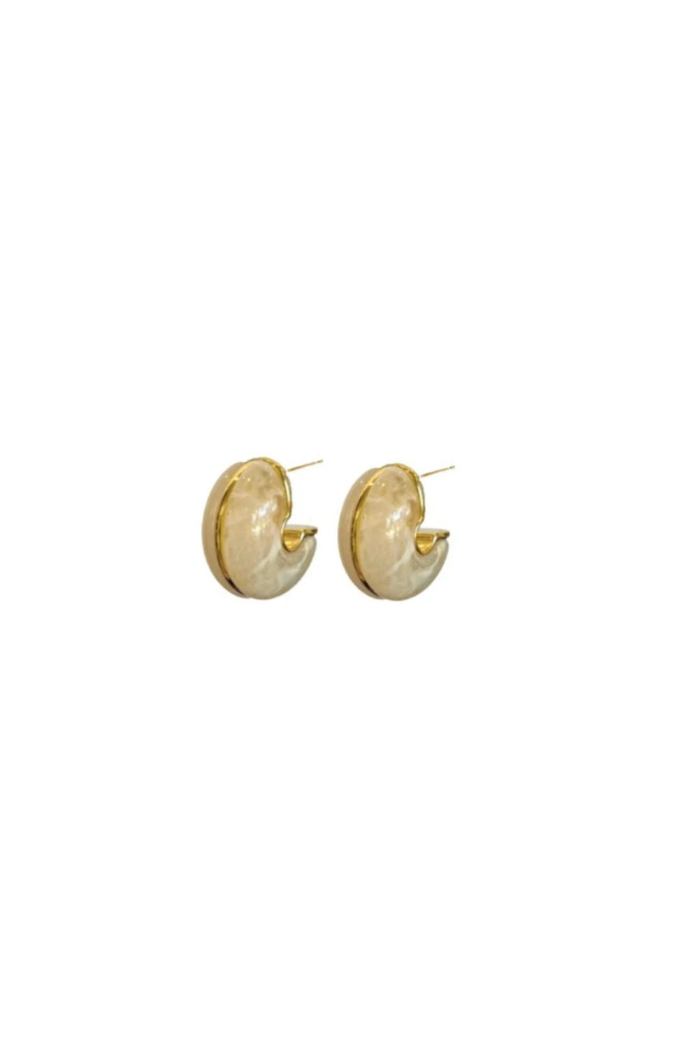 Gold hoop earrings on a white background