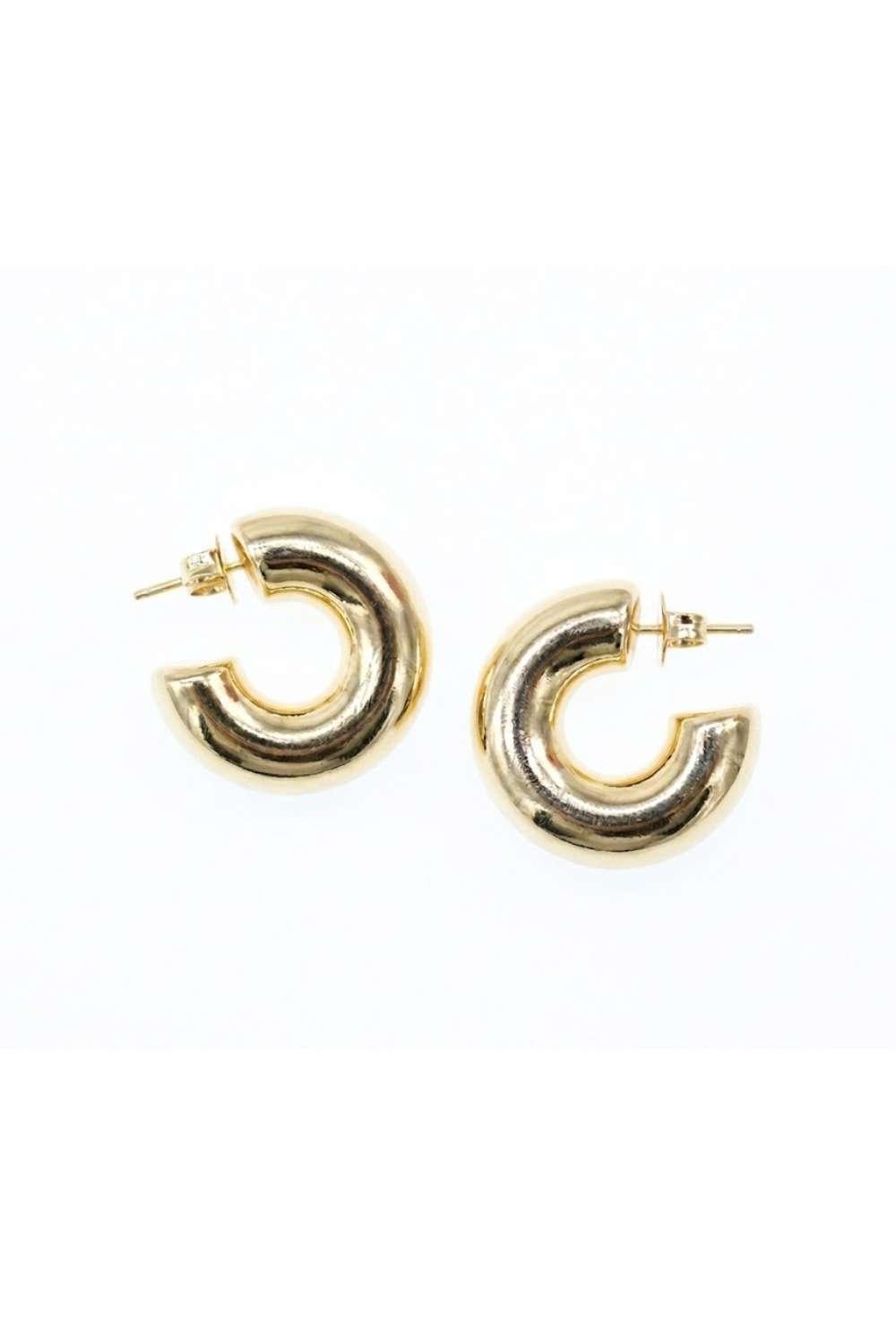 Gold hoop earrings on a white background