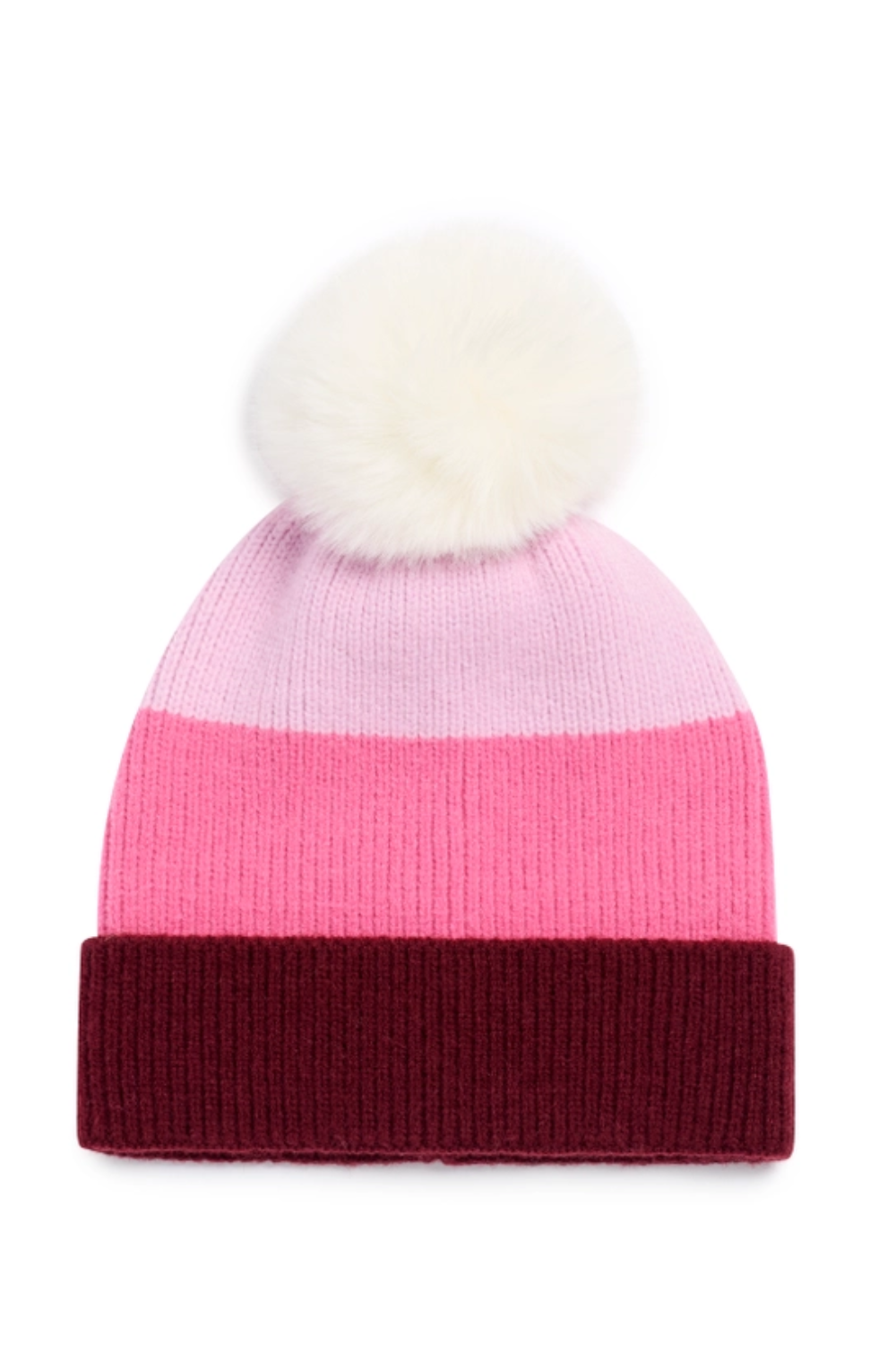 A striped knit beanie hat featuring horizontal bands of light pink, medium pink, and dark burgundy, topped with a fluffy cream faux-fur pom-pom.