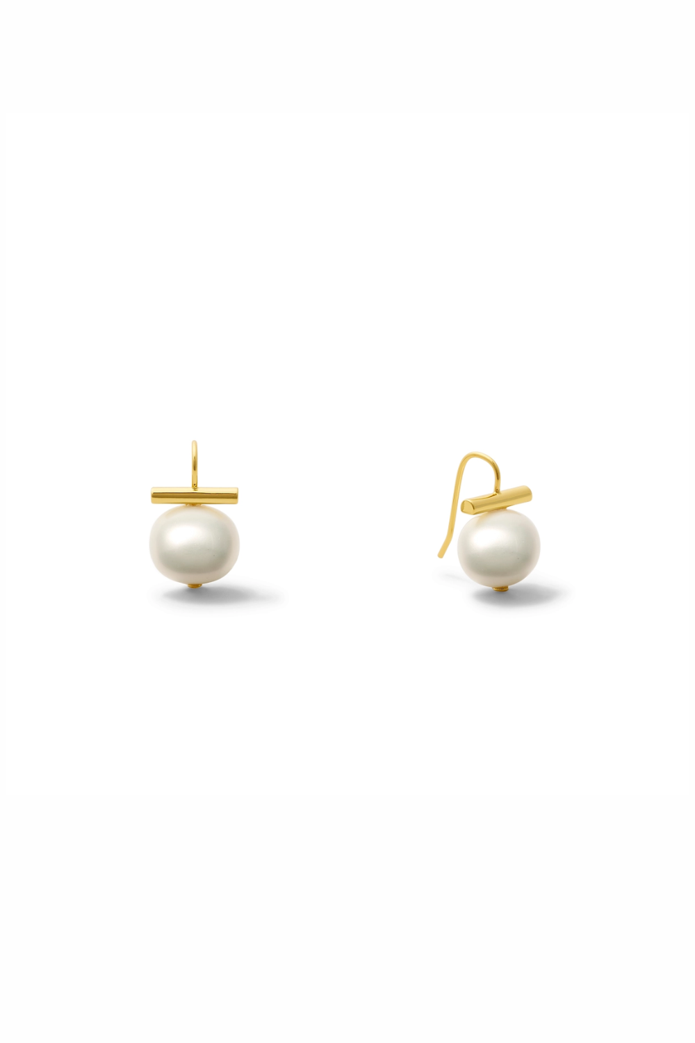 Pair of pearl earrings with gold hooks on a white background