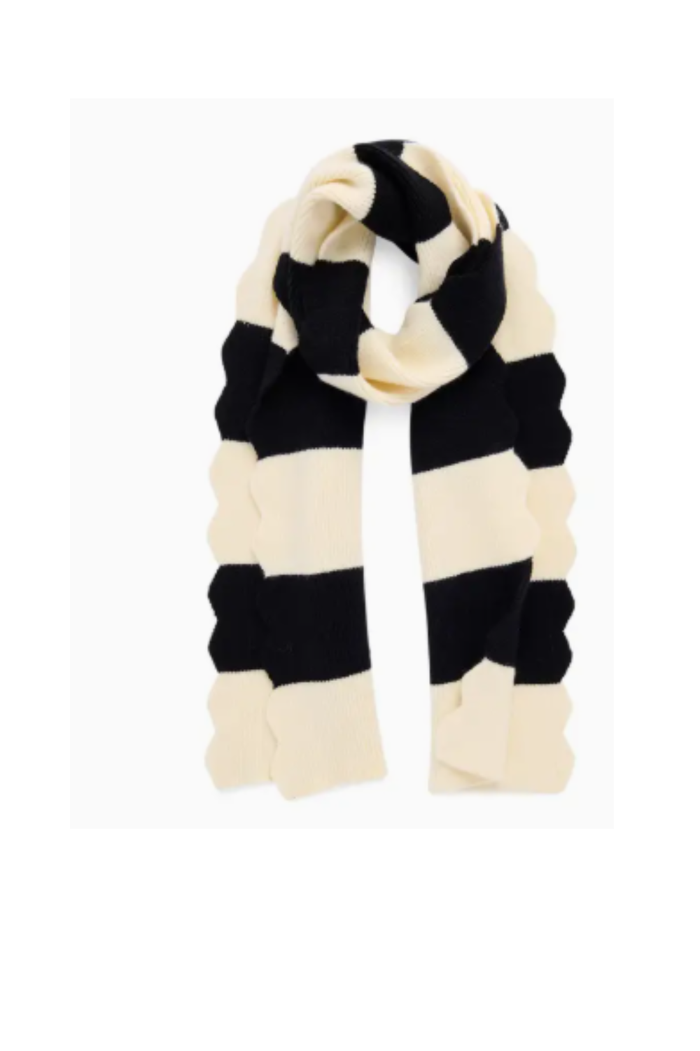 A knit scarf with alternating wide black and cream-colored horizontal stripes, styled in a loop on a white background.
