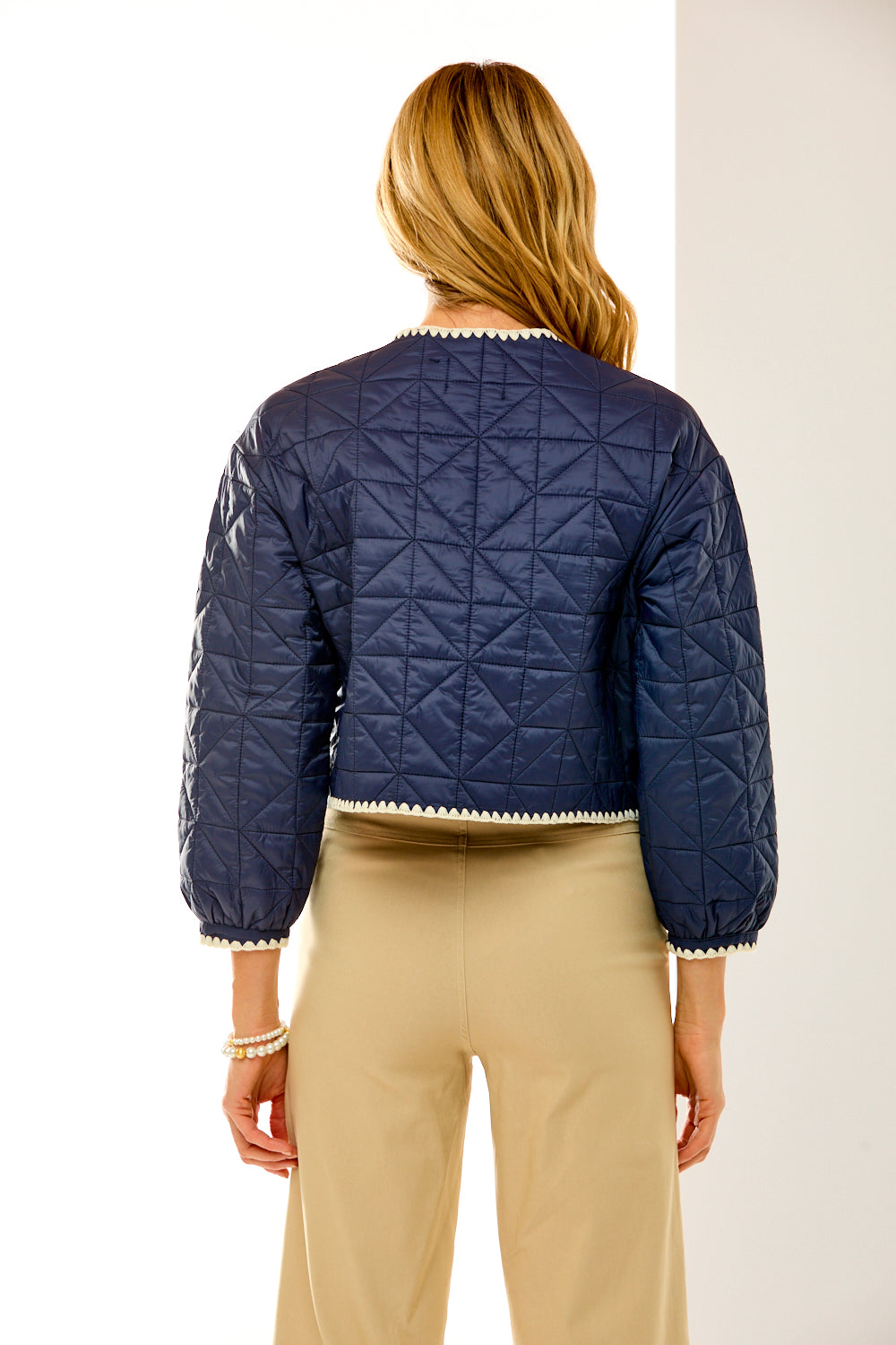 Woman in navy quilted jacket