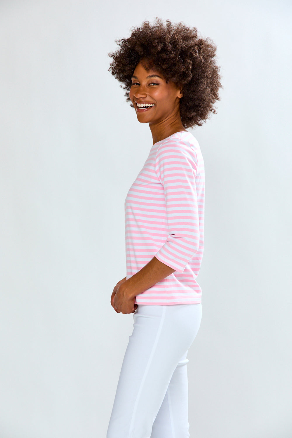 Woman in pink/white stripe knit top