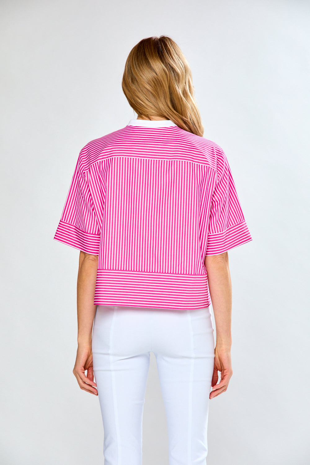 Woman in pink and white striped blouse