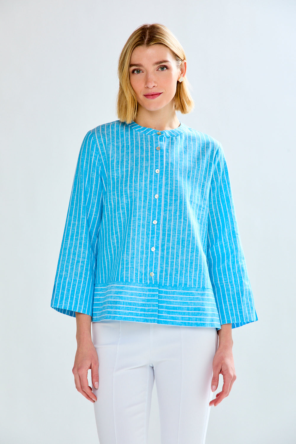 Woman in blue striped tunic