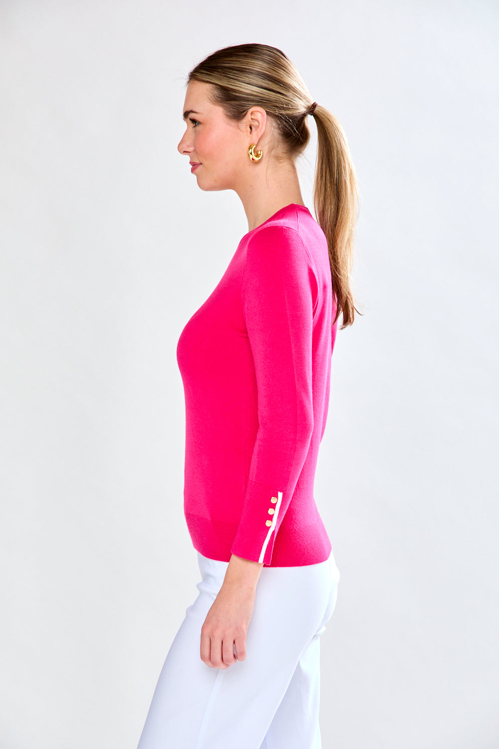 Woman in pink/white sweater