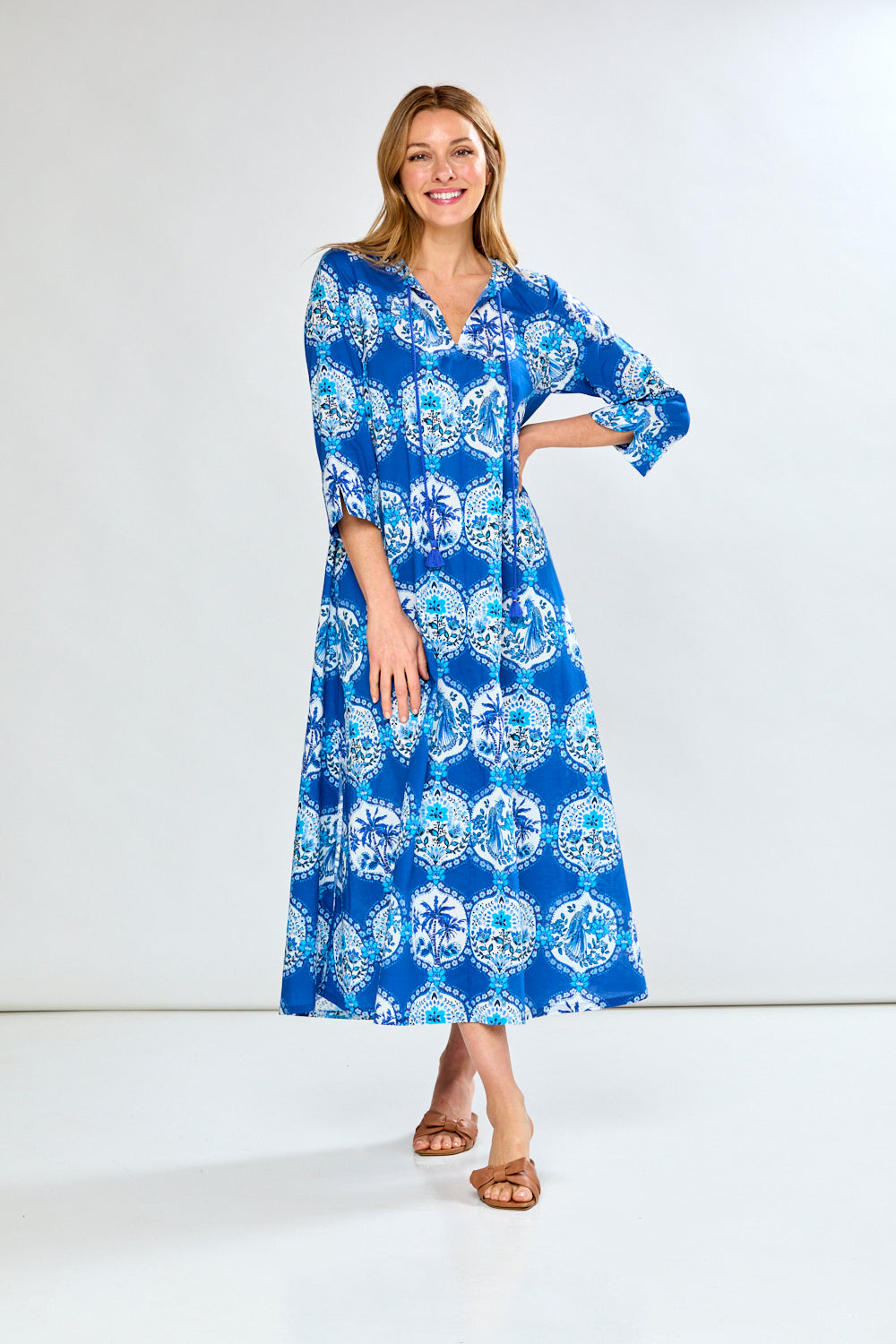 Woman in blue french tile caftan