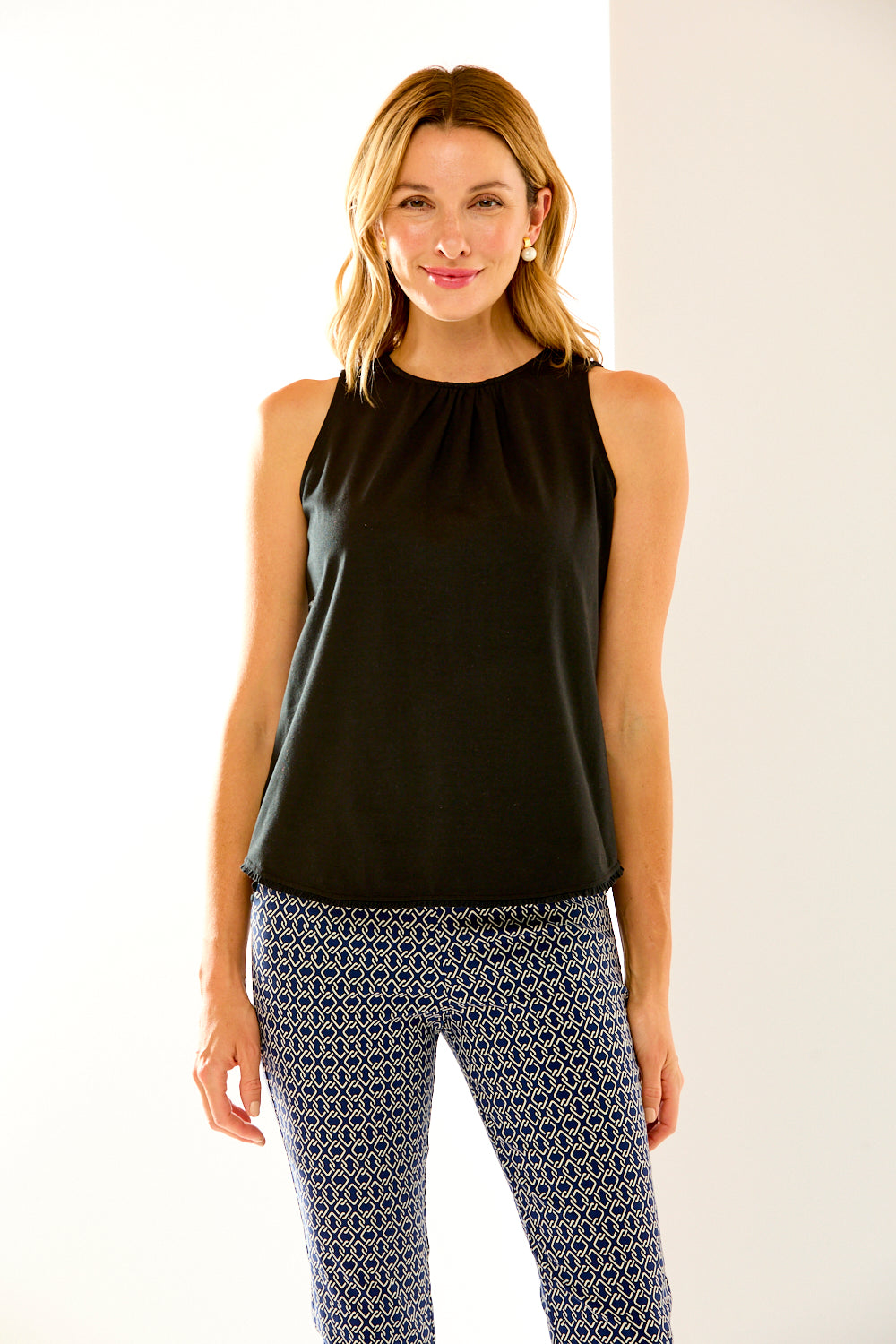 Woman in black sleeveless top