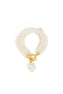 Pearl bracelet with a gold clasp on a white background