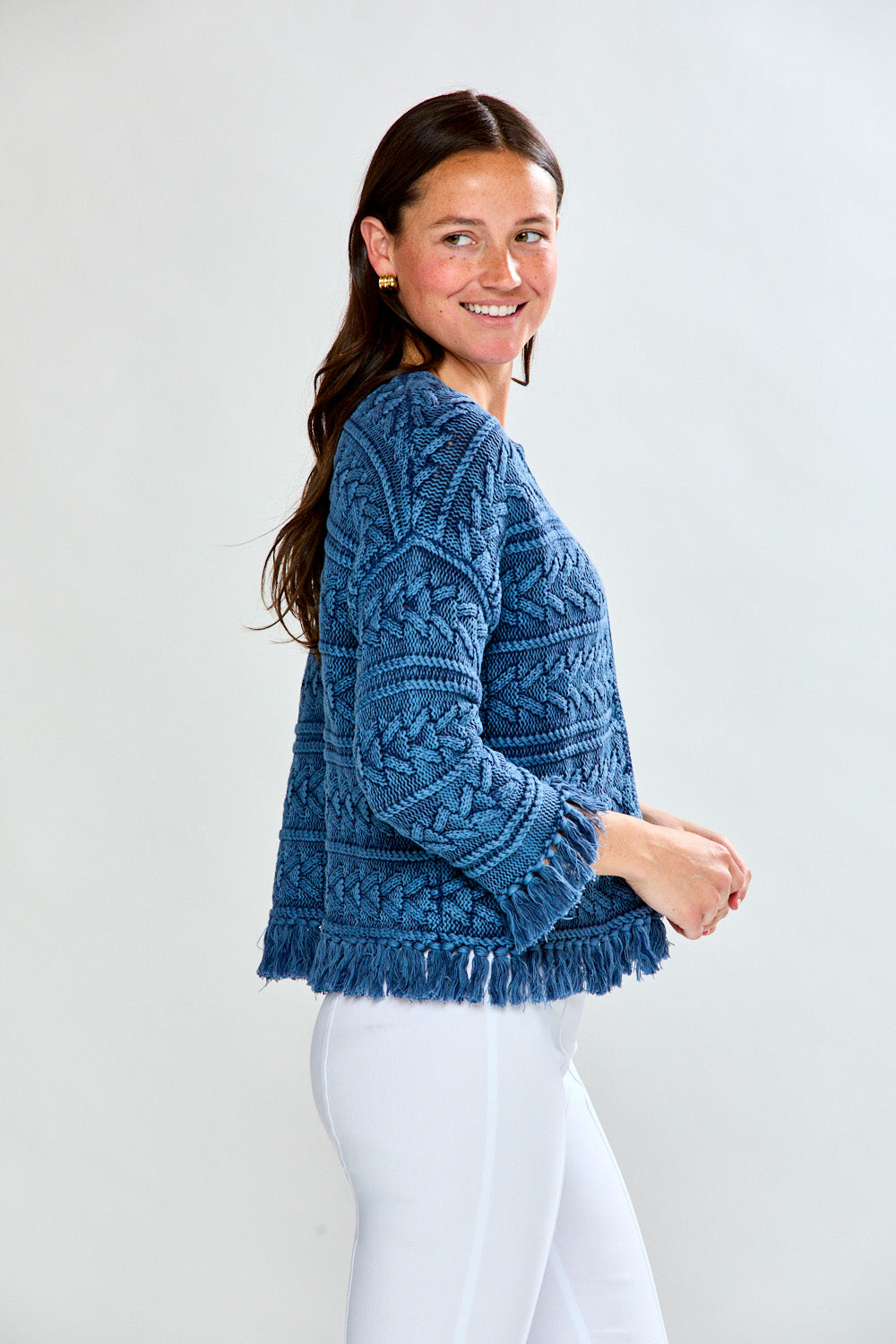 Woman in denim fringe cardi